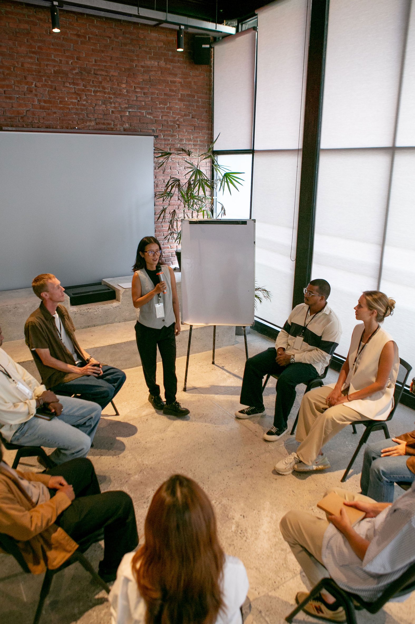 Round Table Discussion in Workshop with Speaker in Modern Office